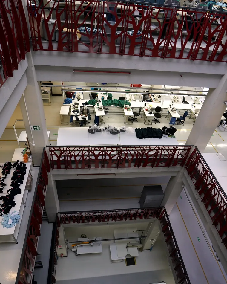 Sewing lines and work tables on the production floor.